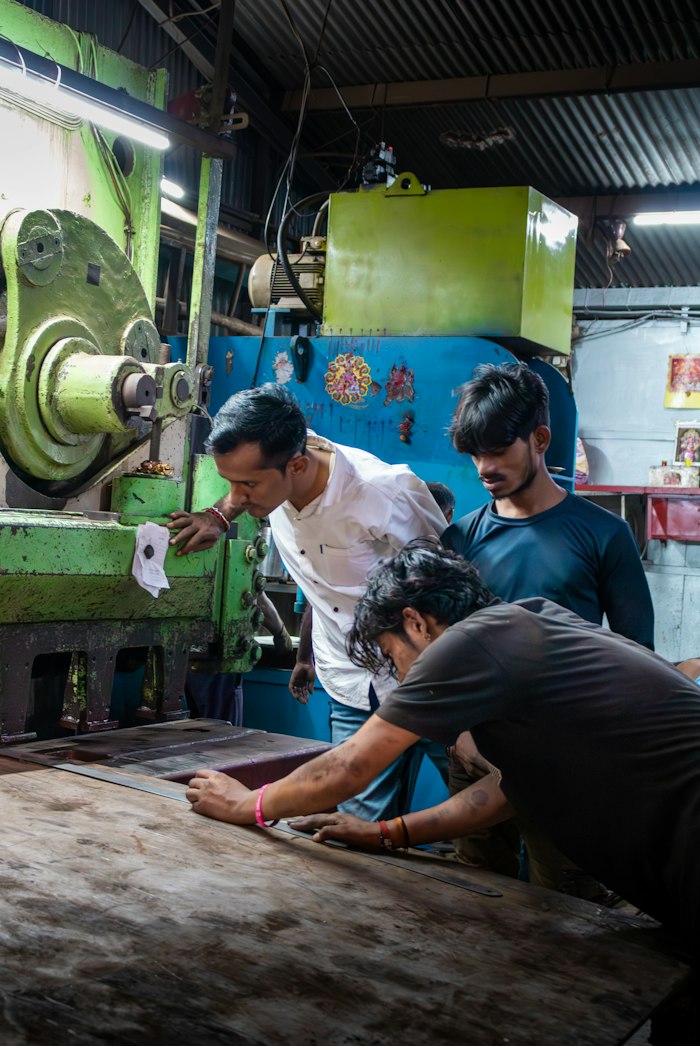 Workers at machines in a workshop